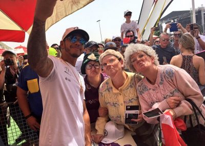 The Dancing Grannies with Lewis Hamilton taking a selfie at the Bahrain Grand Prix